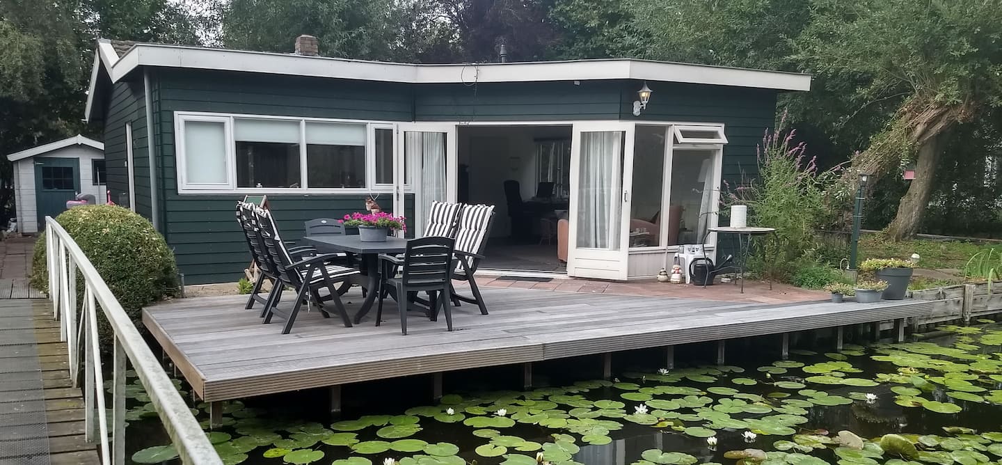 The bungalow and its front deck over the water
